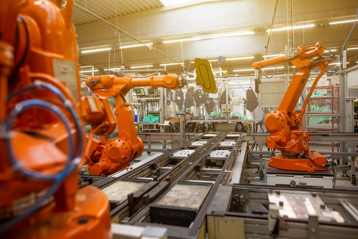 Industrial robotic arm in manufacturing facility